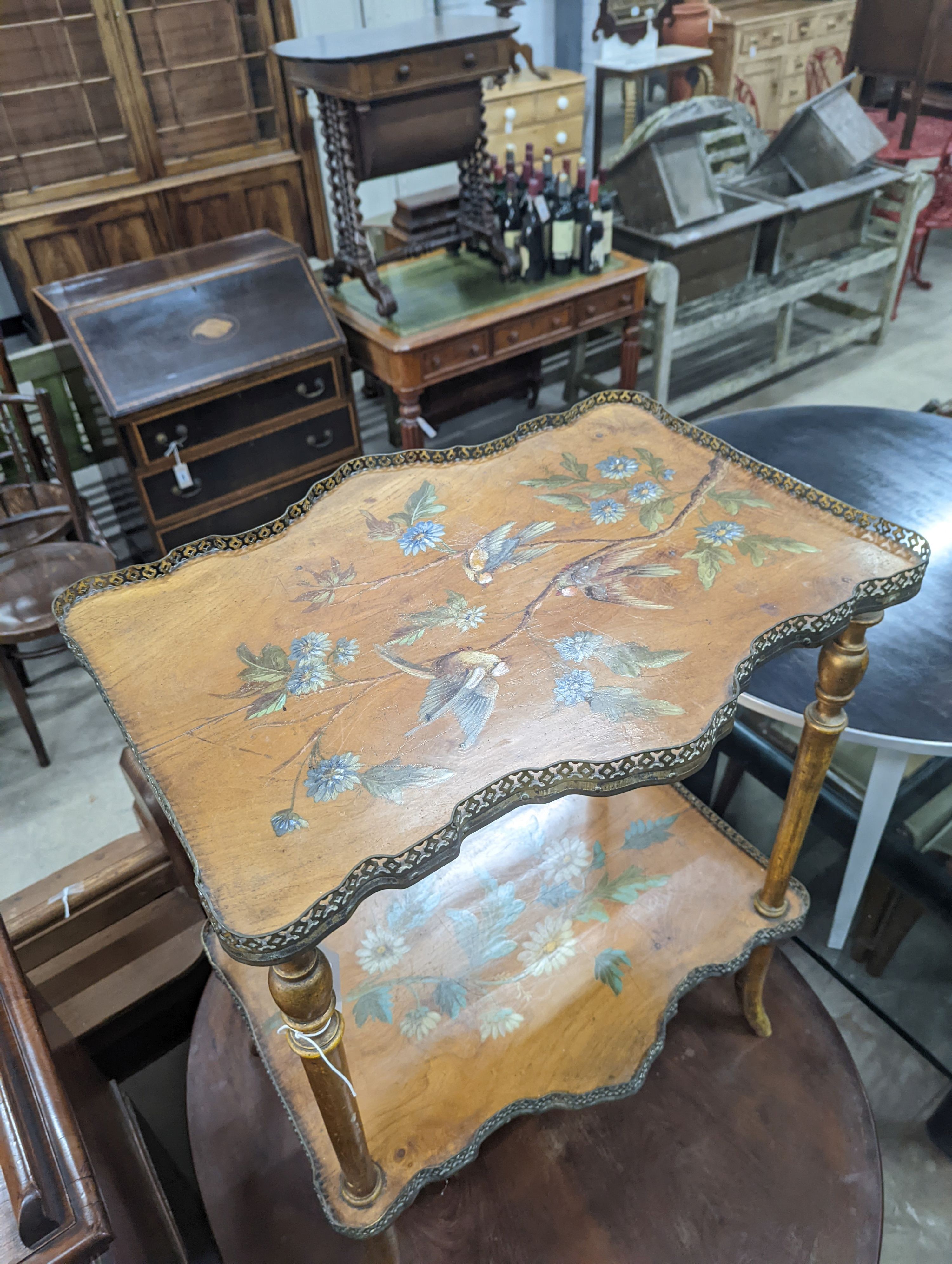 A late Victorian two tier walnut etagere, painted with birds amongst flowers, width 58cm, depth 43cm, height 74cm